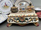 a lot of plates and bowls on the table