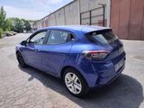 the rear end of a blue car parked in a parking lot