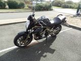 a black motorcycle parked on the side of the road