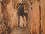 painting of a woman in a white robe walking down a narrow alley