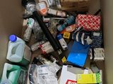 a cardboard box filled with assorted items in it
