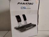 a box of fanatec on the table next to a computer mouse