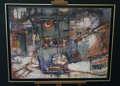 a picture of a painting on a easel in a room