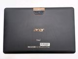 the back side of a laptop with a metal handle on it