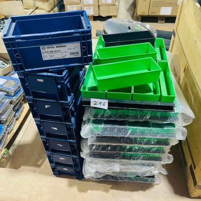 many plastic bins stacked on top of each other