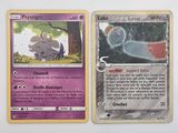 deux cartes Pokémon posées sur une surface blanche ; l'une représente un éléphant et l'autre représente un éléphant