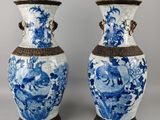 pair of blue and white vases with handles and handles
