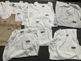 a lot of t - shirts that are on a table