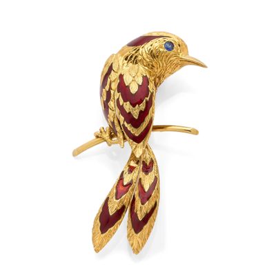a close up of a bird broochle on a white background
