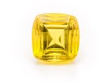 a yellow sapphire stone on a white background