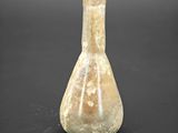 an image of a glass vase on a black surface