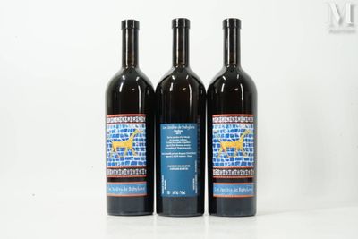 three bottles of wine sitting next to each other on a table
