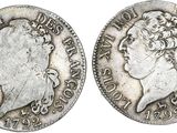 a silver coin with a woman ' s head and a crown on it