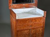 a small wooden cabinet with a mirror on top of it