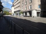 a train that is on the tracks in the middle of the street