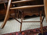 a chair that is sitting on a rug in a room