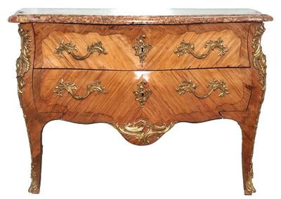 a wooden chest of drawers with a marble top