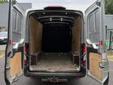 the back of a van with its doors open in a parking lot
