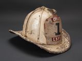 an old fireman ' s hat with the number 1 on it