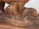 a statue of a horse and a dog on a table