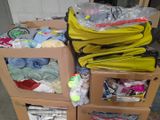 a carton full of clothes and other items sitting on the floor