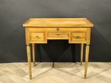 a wooden desk with two drawers and a drawer underneath it