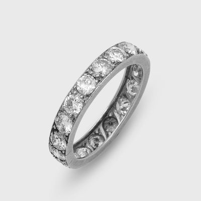 a close up of a diamond ring on a white background