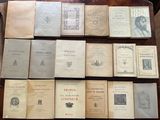 several books on a table are stacked on top of each other
