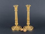 pair of antique brass candlesticks with cork stoppers