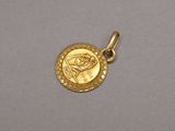 a gold coin with the head of a woman on it