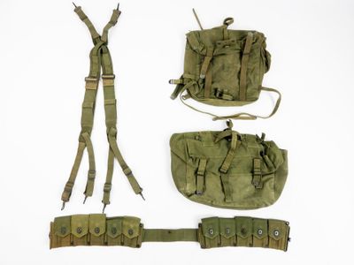 an image of a group of military items on a white surface