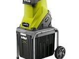 a green and black machine with wheels on a white background