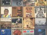 a lot of records on the wall of a room