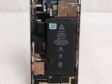 an image of a cell phone with a broken battery on it ' s side
