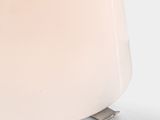 a close up of a toaster on a white surface