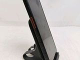 a cell phone that is sitting on a stand