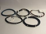 four different bracelets are shown on a white surface