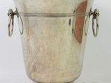 silver plated ice bucket with handles and handles on a stand