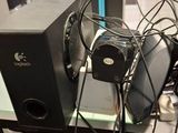 a table with speakers and a fan on it