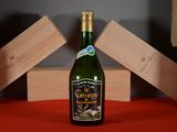 a bottle of wine that is sitting on a table