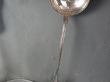 two spoons and a bowl sitting on a table