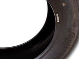 an image of a tire with a white background and a black rim