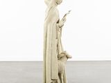 an image of a statue of a woman holding a lamb