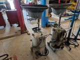 two tanks that are sitting next to each other on the floor