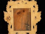 a picture of a picture frame that is made of wood