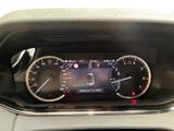 the dashboard of a car with a digital display on it