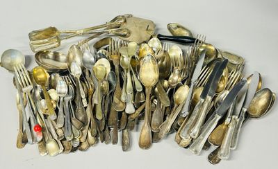 a lot of spoons and forks on the table