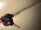 a car key that is attached to the back of a car seat