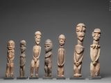 six carved figurines of men and women in various poses
