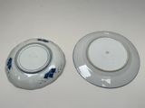 two plates that are sitting on a table